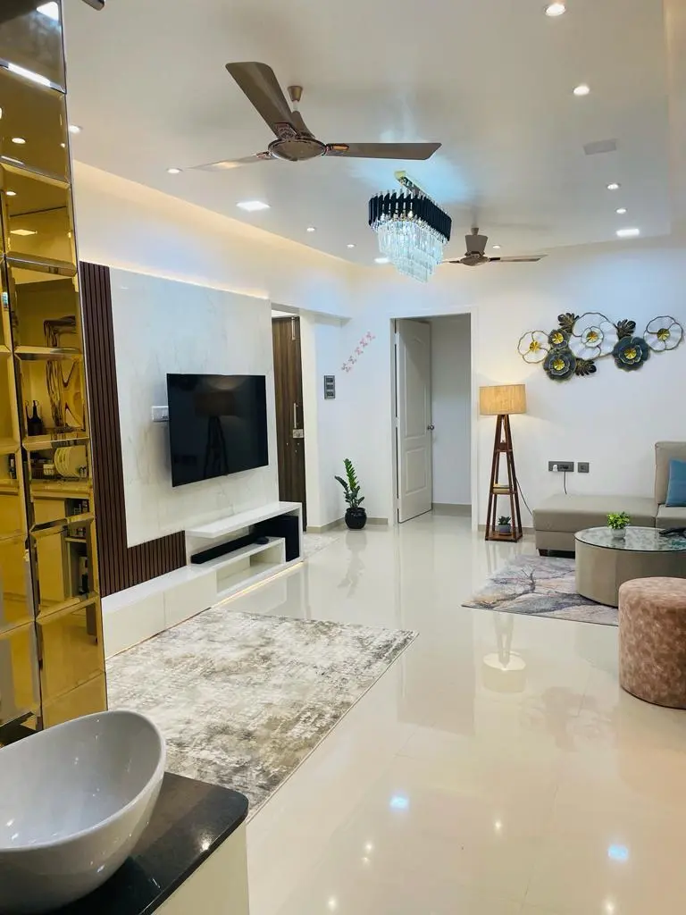 Hall with crystal pendant and cove lights